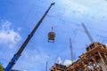 Crane working in construction on blue sky Royalty Free Stock Photo