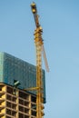 crane is working under the blue sky, in Zhuhai city, CHINA. Royalty Free Stock Photo