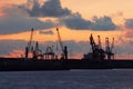 Cranes in Bilbao harbour at sunset