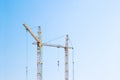 Cranes on blue sky