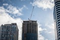 Cranes and building devices on a construction site of a skyscraper in downtown Toronto, surrounded by other high rise towers Royalty Free Stock Photo