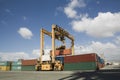 Cranes And Cargo Containers At Dock