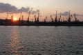 Cranes in the cargo port in Odessa at sunset Royalty Free Stock Photo