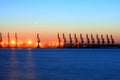 Cranes at the cargo terminal in the evening Royalty Free Stock Photo