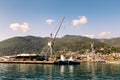 Cranes at cargo terminal in Kotor bay. Montenegro docking station with cranes and tug boats. Royalty Free Stock Photo