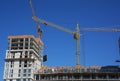 Cranes construction. Building construction growth and global construction industry concept