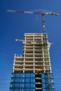 cranes at the construction site of an office buildingg in Poznan Royalty Free Stock Photo