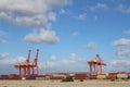 Cranes in container ship harbour against blue sky Fremantle, Western Australia Royalty Free Stock Photo