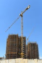 Cranes at costruction site in new urban developing zone Royalty Free Stock Photo