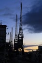 Cranes in The dock at Harbourside area at sunset Royalty Free Stock Photo