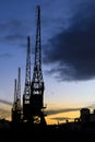 Cranes in The dock at Harbourside area at sunset Royalty Free Stock Photo