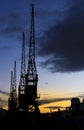 Cranes in The dock at Harbourside area at sunset Royalty Free Stock Photo