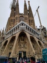 Cranes entry front door la sagrada de familia in Barcelona church towers cathedrals religious Barcelona people tourists