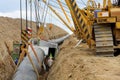 Cranes laying gas pipeline and welding cabin Royalty Free Stock Photo