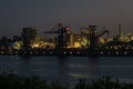 Cranes and lights in the harbor of Rotterdam, The Netherlands Royalty Free Stock Photo