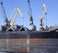 Cranes loading ship Royalty Free Stock Photo