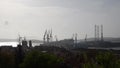 Cranes in Shipyard at sunset. Harbour in Adriatic sea. Jackup rig, Oil platform and Container crane in Dockyard. Ship port. Indust