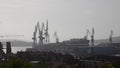 Cranes in Shipyard Uljanik in Pula, Croatia. Harbour at Adriatic sea. Cranes, Jackup rig, Oil platform and Container crane in Dock