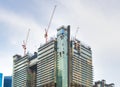 cranes skyscraper construction site Singapore Royalty Free Stock Photo