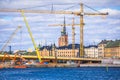 Cranes at Stockholm city Gamla Stan island construction site view