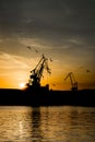 Cranes at Sunset in Harbor of Pula in Croatia Royalty Free Stock Photo