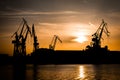 Cranes at Sunset in Harbor of Pula in Croatia Royalty Free Stock Photo