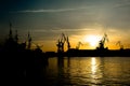 Cranes at Sunset in Harbor of Pula in Croatia Royalty Free Stock Photo