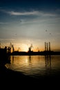 Cranes at Sunset in Harbor of Pula in Croatia Royalty Free Stock Photo