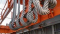 The cranes thick cables and pulleys able to withstand tremendous weight and pressure