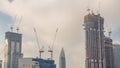 Cranes working on modern constraction site works of new skyscraper timelapse