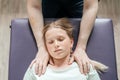 Ostheopatic treatment of a girl patient using CST gentle hands-on technique, central nervous system tension relieve