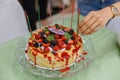 Crape Cake on top with Mixed Berries and Strawberry Sauce