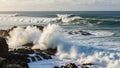 Crash against dark jagged rocks creating dramatic splashes of Royalty Free Stock Photo