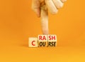 Crash course symbol. Concept words Crash course on wooden cubes. Beautiful orange table orange background. Businessman hand.