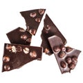 Crashed blach chocolate bar with large hazelnuts