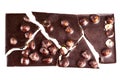 Crashed blach chocolate bar with large hazelnuts