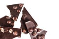 Crashed blach chocolate bar with large hazelnuts