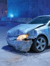 Crashed blue car with front-end damage at night Royalty Free Stock Photo