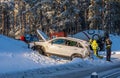 Crashed car in the ditch of a winter road in Sweden