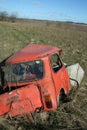 Crashed car in field Royalty Free Stock Photo