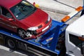 Crashed car loaded on a tow truck Royalty Free Stock Photo