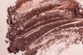 Crashed eyeshadow. Macro texture of make-up on beige background. Royalty Free Stock Photo