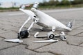 Crashed modern drone and camera after drone accident