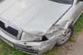 Crashed silver car front fender insurance accident broken collision damage