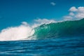 Crashing perfect blue wave. Breaking surfing wave, power of ocean