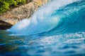Crashing perfect wave in ocean. Breaking blue barrel wave