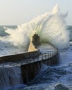 Crashing wave over harbour wall Royalty Free Stock Photo