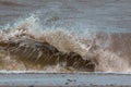 Crashing wave breaking on the shore. Force of nature image Royalty Free Stock Photo