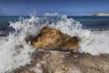 Crashing wave on a Greek beach Royalty Free Stock Photo