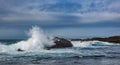 Crashing waves at rocky ocean cliffs